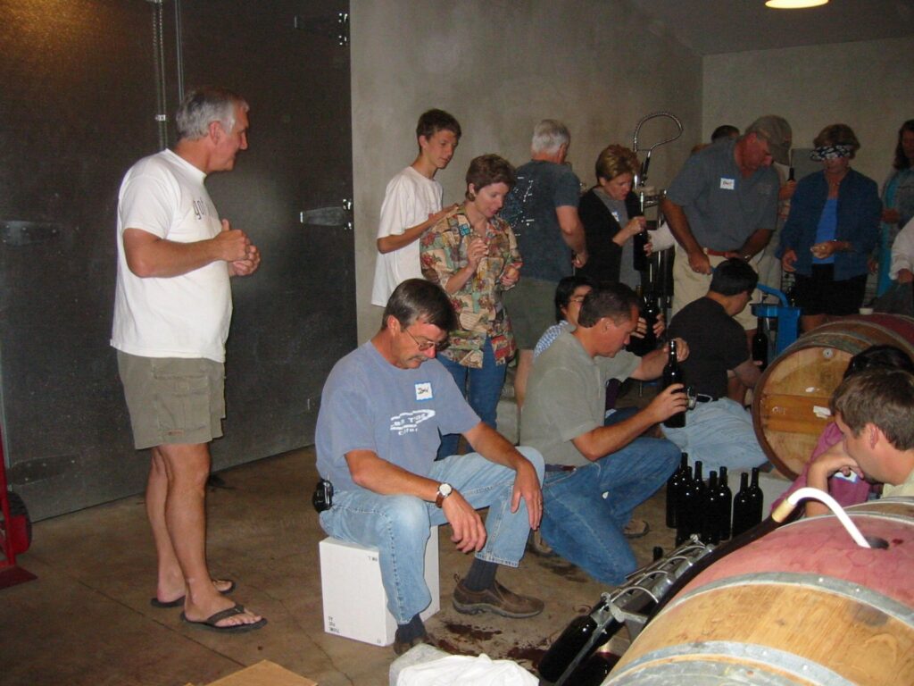 group of people bottling wine