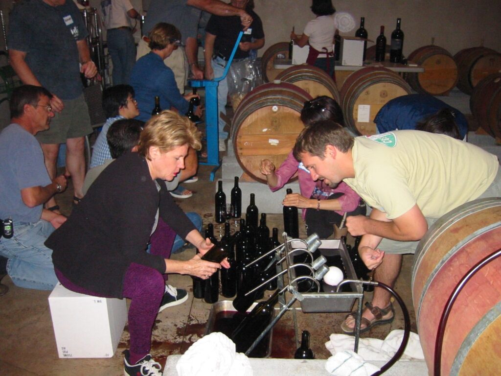 group of people bottling wine