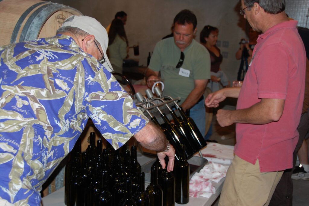 group of people bottling wine