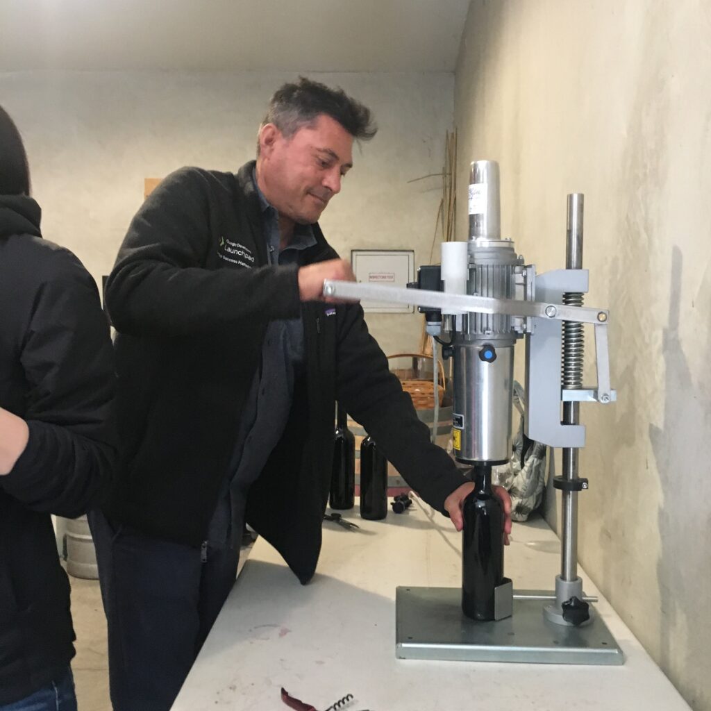 group of people bottling wine