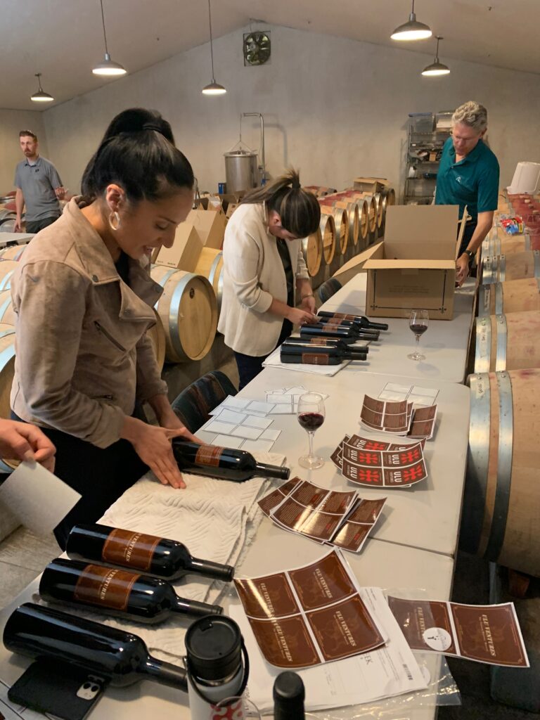 group of people bottling wine